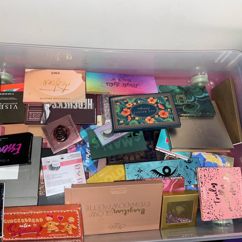 Box of high end makeup palettes